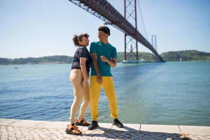 couple being having fun under the bridge.
