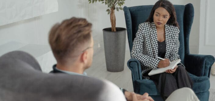 Man consulting a therapist