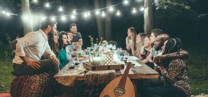 Group of friends drinking in a backyard
