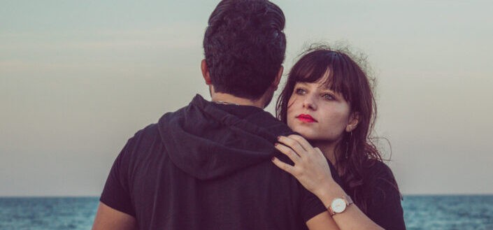 man and woman near a beach