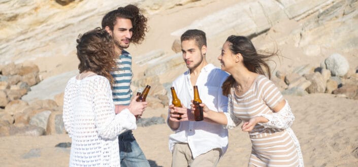 Group of young adults drinking beer