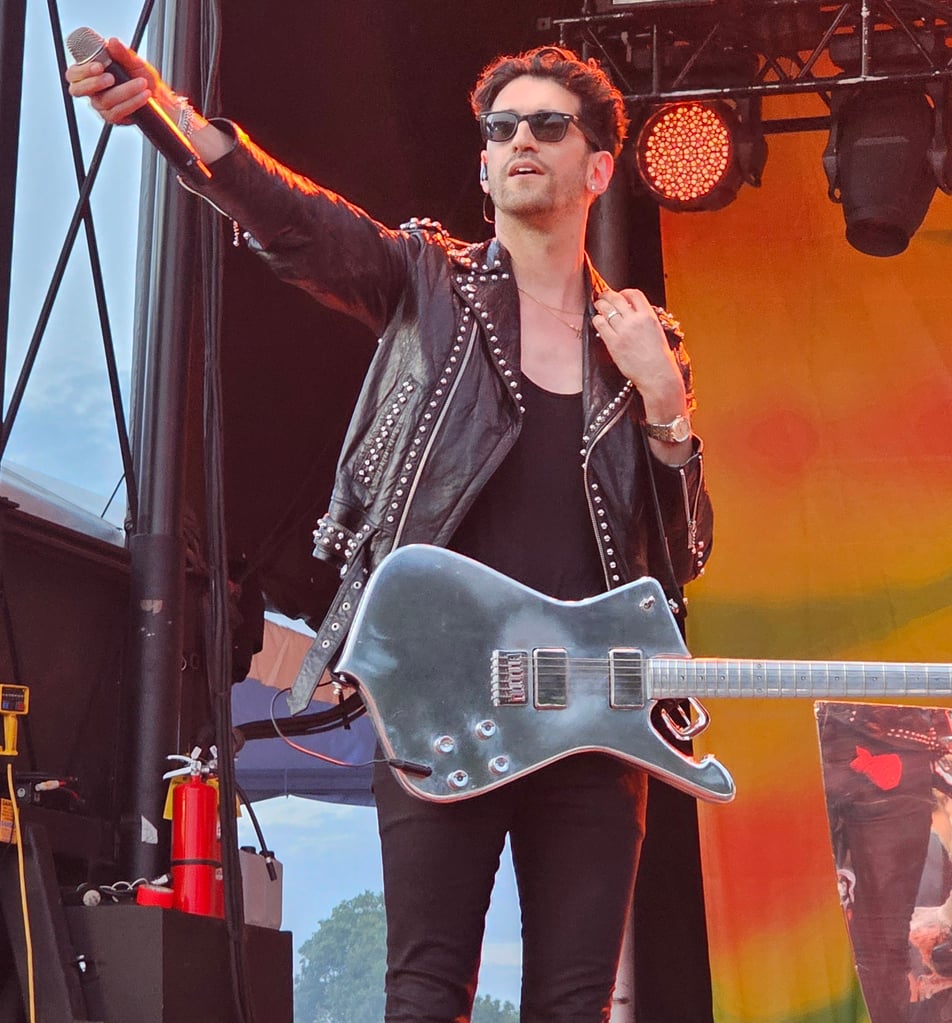 Dave 1 of Chromeo motioning to the audience at 420 Fest 2026