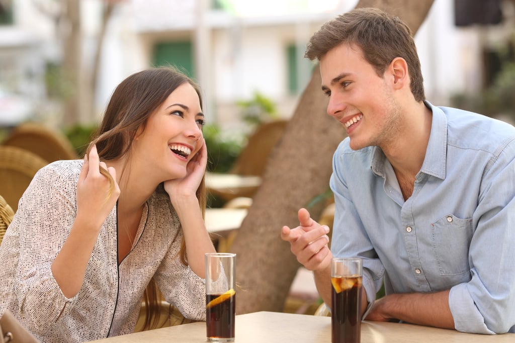 Couple on date outside with non alcoholic drinks
