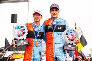 Thierry Neuville (BEL), Martijn Wydaeghe of team HYUNDAI SHELL MOBIS WORLD RALLY TEAM celebrate on the podium in first place after winning the World Rally Championship in Porto, Portugal.