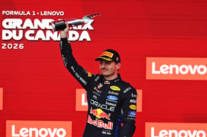 MONTREAL, QUEBEC - MAY 24: Third placed Max Verstappen of the Netherlands and Oracle Red Bull Racing lifts his trophy on the podium during the F1 Grand Prix of Canada at Circuit Gilles-Villeneuve on May 24, 2026 in Montreal, Quebec.