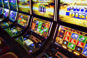 Bright casino slot machines displaying colorful reels and bonus features, representing popular Zeus-inspired slot games with immersive mythological themes.