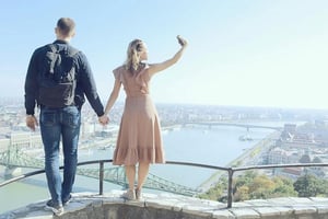 A couple meeting outdoors in an urban environment after a while.