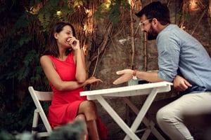 A man and woman sitting together having a meaningful conversation, representing communication and emotional connection in modern dating.