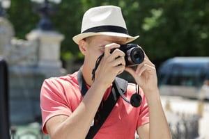 A man capturing photos on a vacation.